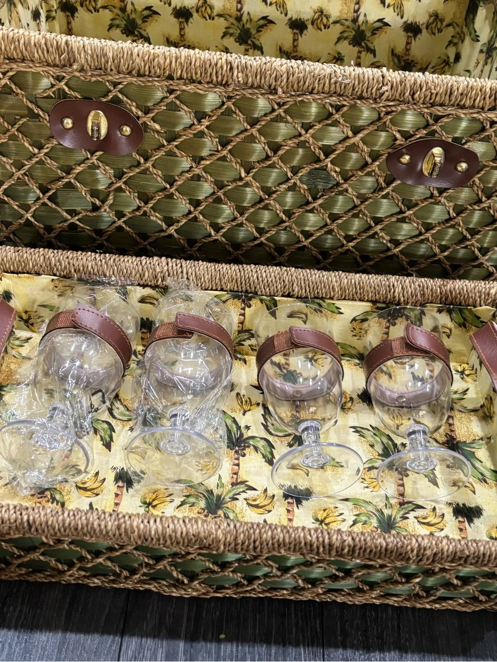 Vintage wicker and tropical palm green picnic basket service for four